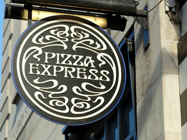 Pizza Express is reopening 13 London branches for delivery pizza express sign at the front of one of its UK branches