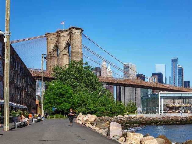 A two-acre green space is opening under the Brooklyn Bridge