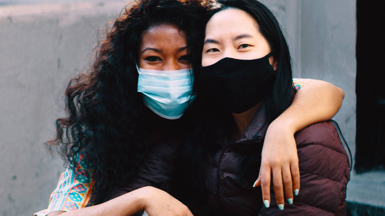 two women with masks on