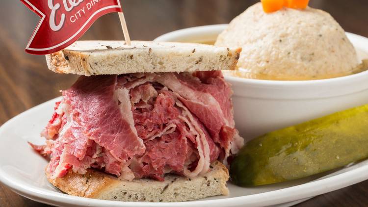 A corned beef sandwich and matzo ball soup.