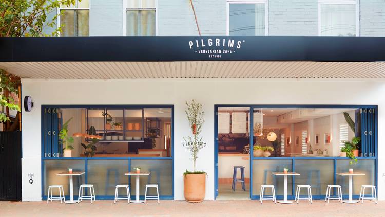 Shopfront with chairs and tables outside