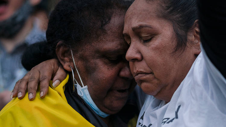 Two protestors console each other at Sydney's Black Lives Matter march