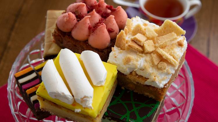 Three different flavoured brownies on a glass plate