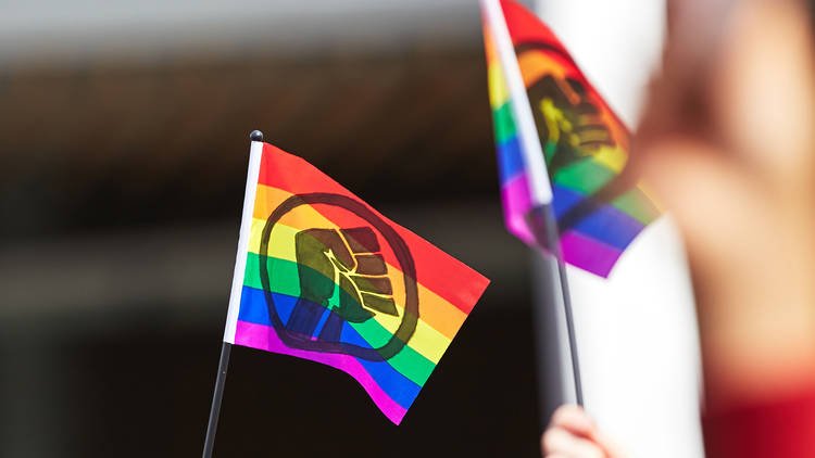 Black Lives Matter logo on rainbow flags at Pride