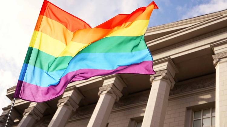 LGBTQ+ flag in front of the Supreme Court