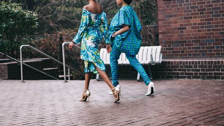 Two women walking along a pathway