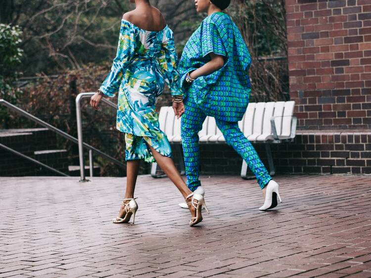 Two women walking along a pathway