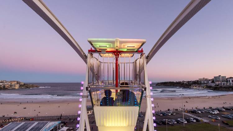 Ferris wheel looking out over the sea