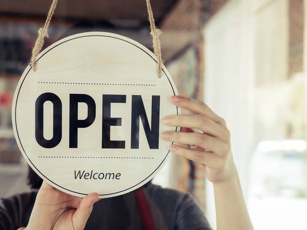 London’s pubs, restaurants, hairdressers, museums, galleries and cinemas can reopen from July 4 Open for business sign in cafe