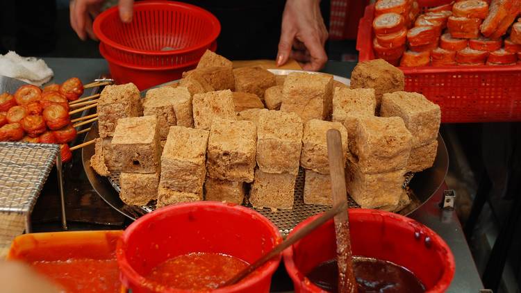 Try some stinky tofu at a street food stall