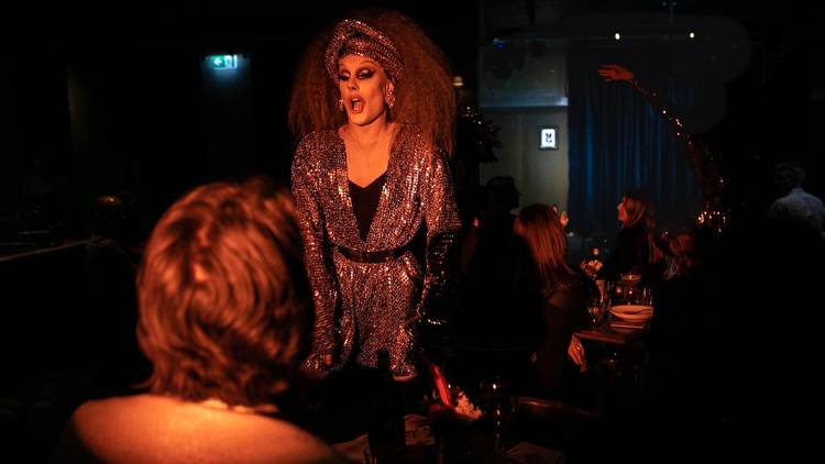 Drag performers on stage