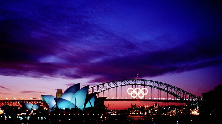 Harbour bridge lit up with Olympics logo