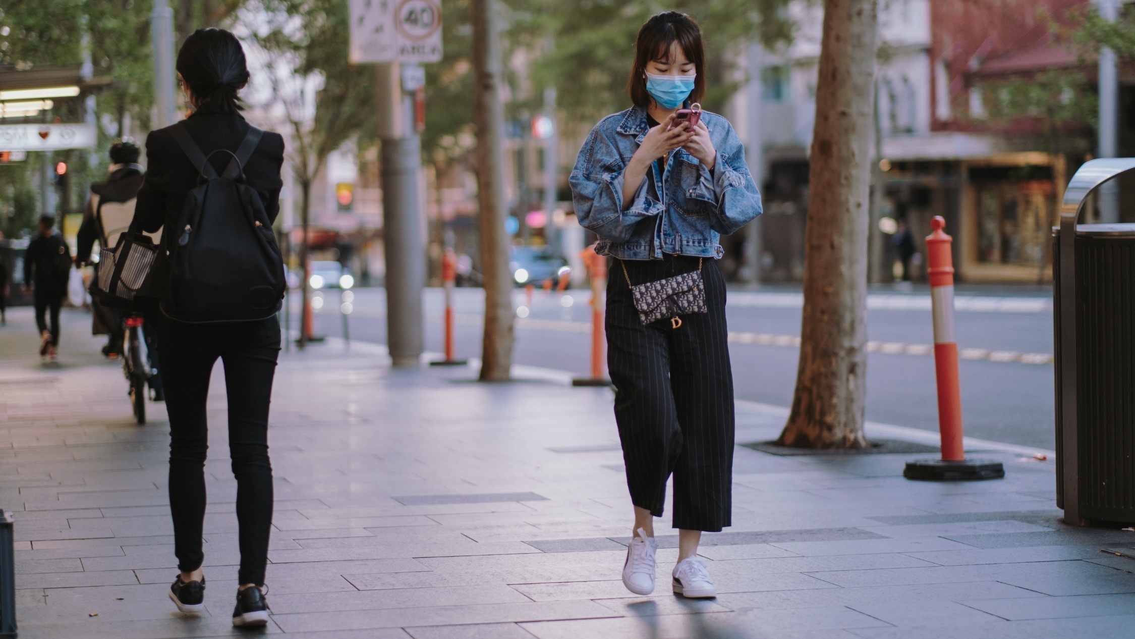 Woman wearing a mask in public