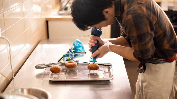 Comeco Foods decorating donuts (Photograph: Daniel Boud)