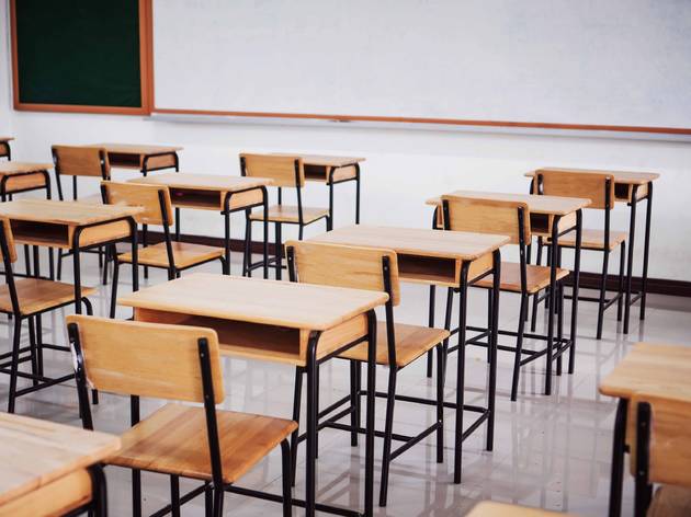 The NYC DOE is hosting a virtual information session about returning to school empty classroom with wooden desks