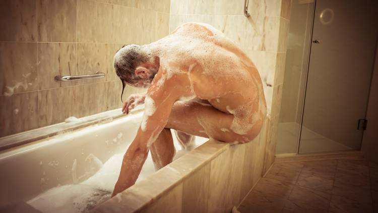 Joel Bray performing Biladurang naked and soapy in a bathtub