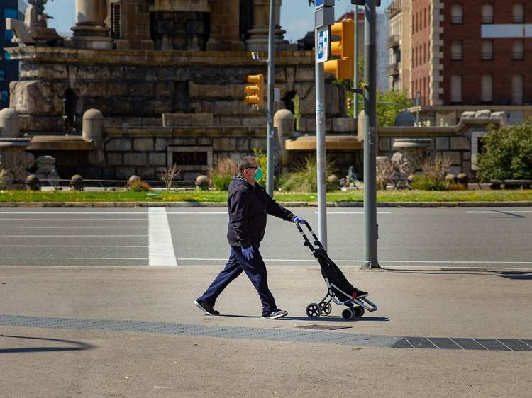 Man walking with mask and gloves in Barcelona