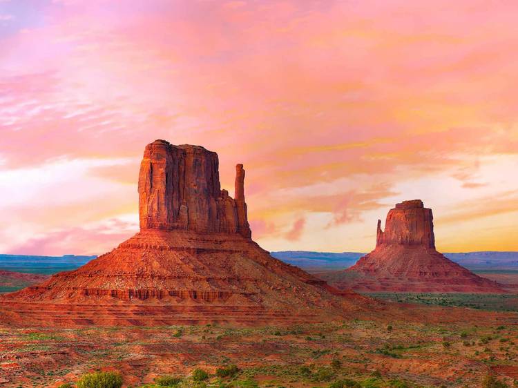 Red skies over Monument Valley's Mitten Buttes