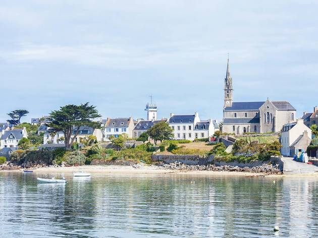 ILE DE BATZ, FRANCE - 22 JUL 2019: View of the island from the sea. ILE DE BATZ, FRANCE - 22 JUL 2019: View of the island from the sea.