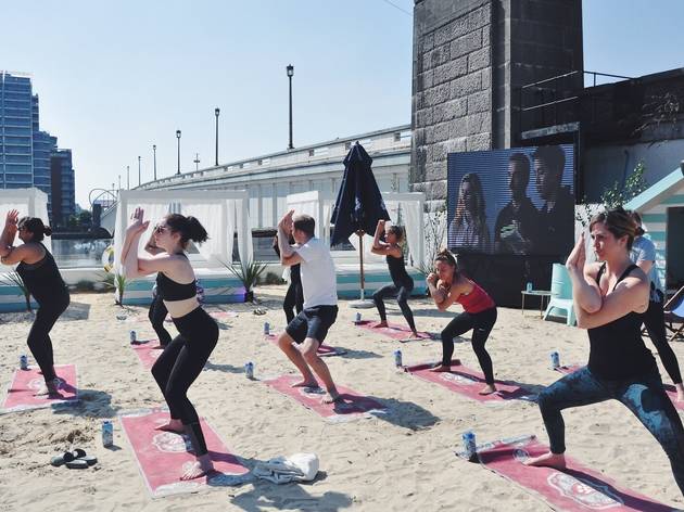 Yoga on the Beach Photograph: Courtesy of Neverland London