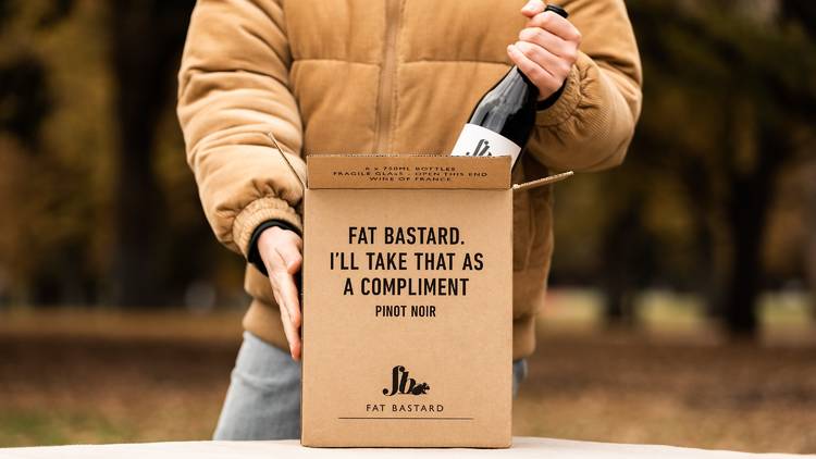 Man pulling wine from box