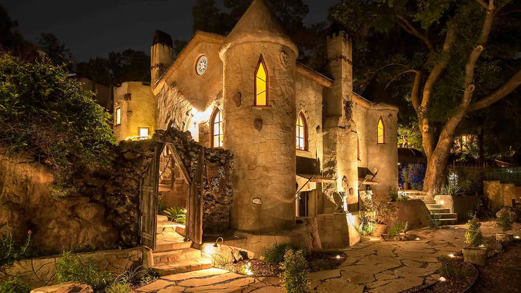 Luxury castle at night with trees