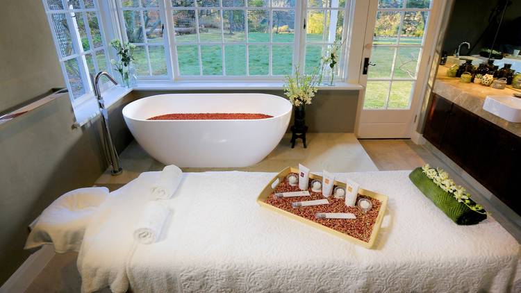 Treatment room with bath tub at Parklands Day Spa