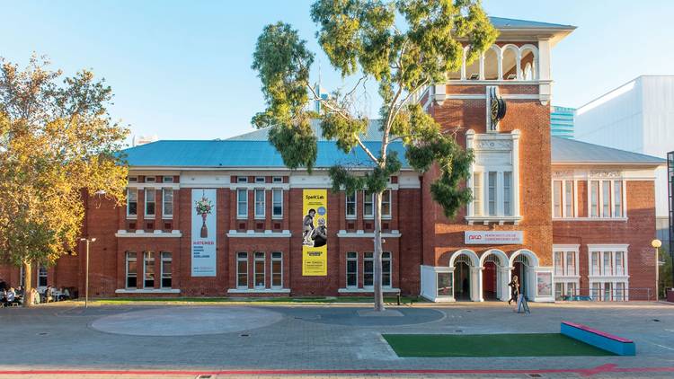 Exterior shot of red brick heritage-listed building housing the Perth Institute of Contemporary Arts