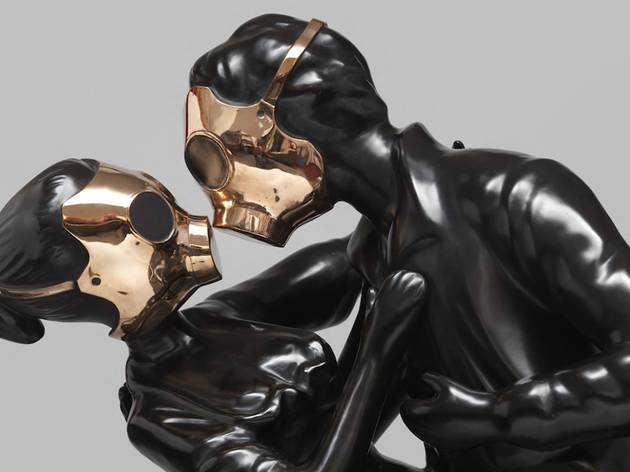 Penny Byrne 'Love in a Time of Corona' Sydney Contemporary Presents 2020 Two sculptural figures in matte black wear bronze gas masks and embrace