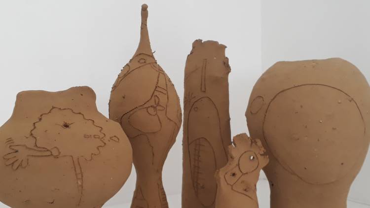  Machiko Motoi's simple clay vases are traced with detailed linework