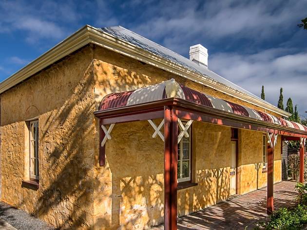Freshwater Bay Museum Brick building with red pillars on patio