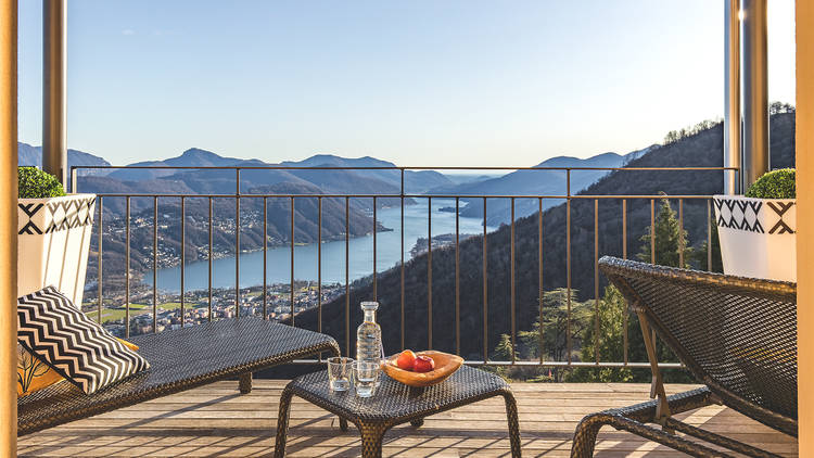 A hotel balcony overlooking Lake Lugano.