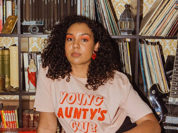 Woman wearing a tshirt that says 'Young Aunty's Club'