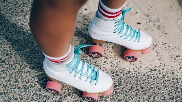 Roller Skates, white with blue laces and link wheels