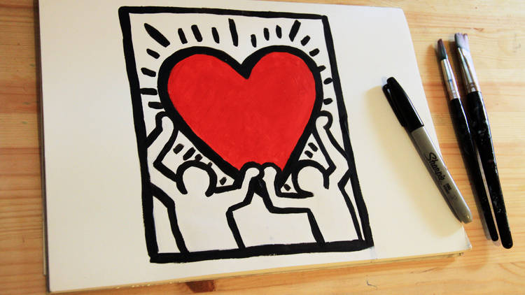 A drawing that replicates a keith haring artwork featuring two people and a love heart