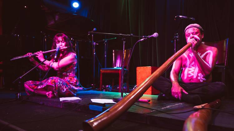 Yulugi playing the flute and didgeridoo 