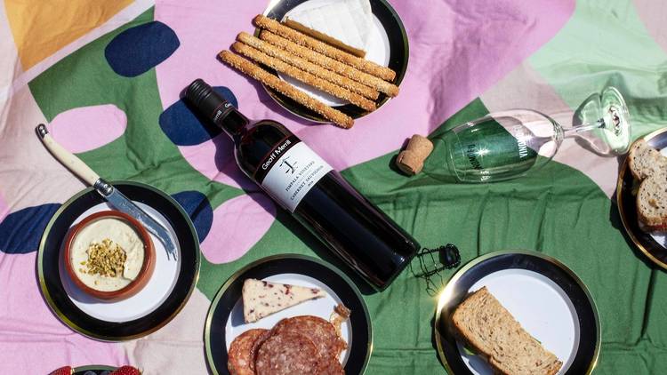Picnic spread with bottle of wine