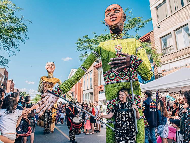 Watch giant puppets wander the streets