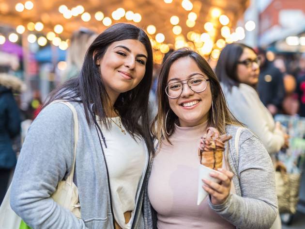 Two women holding ice cream, Eat Your Heart Out Two women holding ice cream