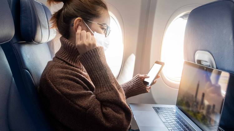 Masked person on plane