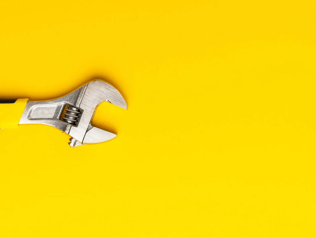 Spanner on a yellow background