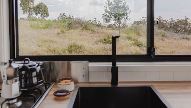 Interior view of tiny house kitchen set up.