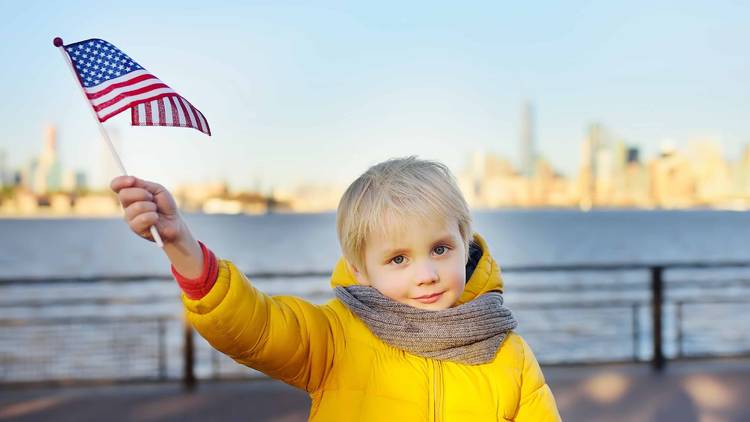 child waving an american flag