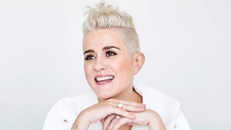 Katie Noonan with short bleached blonde hair in a white shirt 