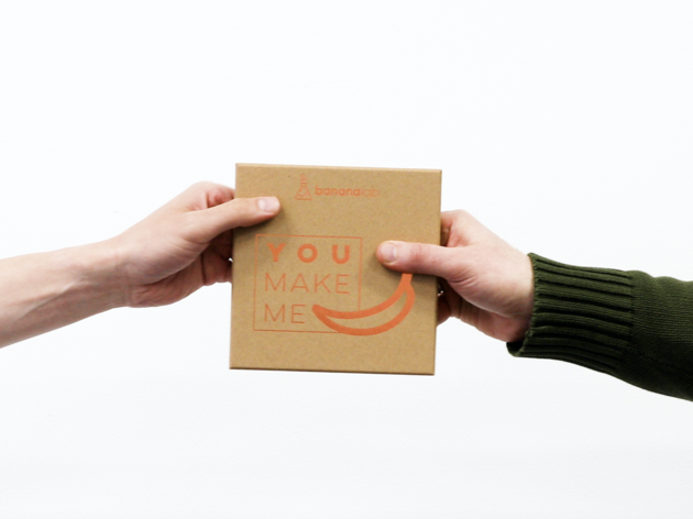 BananaLab gift boxes Two hands holding a BananaLab gift box on a white background