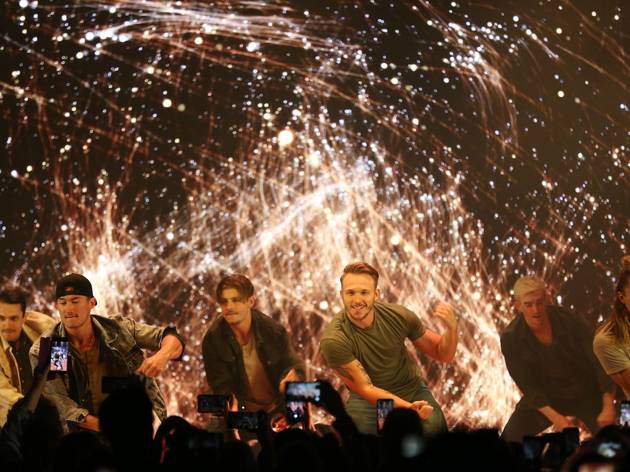 Magic Mike Live Sydney 2020 The Magic Mike Live hotties kneel in front of a firework-like light show