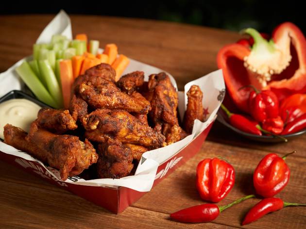 WingFest Winghaus Chicken wing box with chillis nearby