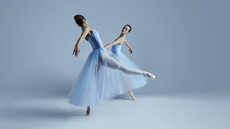 Dancers Ako Kondo and Amber Scott in a pas de deux in pale blue, long tutus