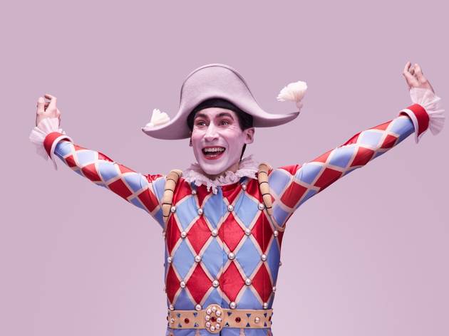 Harlequinade, Australian Ballet 2021 A harlequin in red and blue checked outfit against a pink backdrop