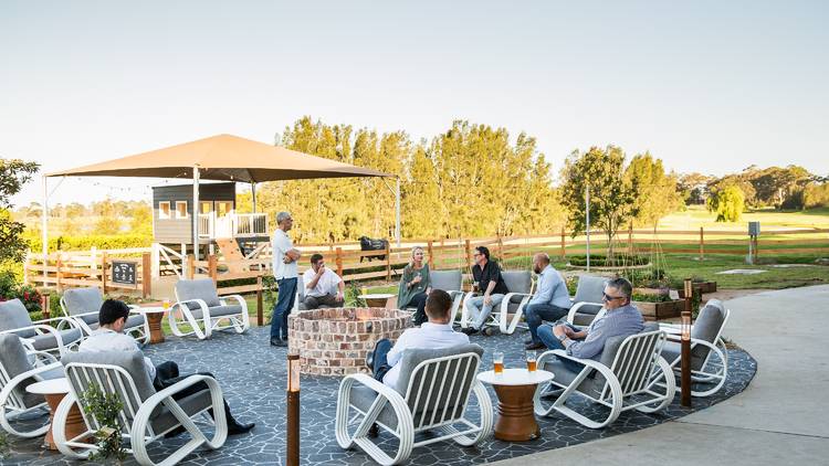 People sitting on chairs outside